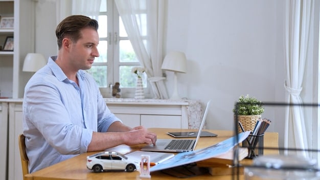 A person sitting at a desk, comparing car loan offers from different lenders on a laptop screen. The background features a home office setting, conveying a sense of personal financial planning.