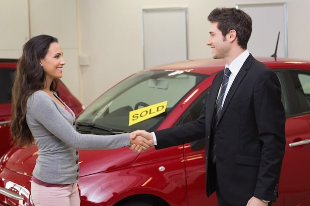 A hand pointing at a price tag on a car in a dealership, suggesting negotiation.