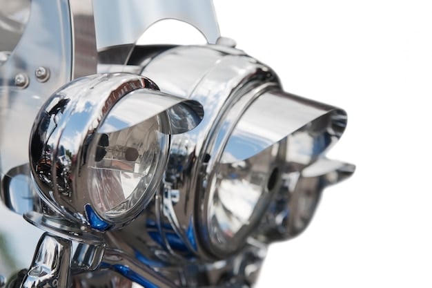 A close-up of a modern car engine showcasing advanced fuel injection technology and a turbocharger system. The engine components are clean and well-maintained, highlighting the precision engineering involved.