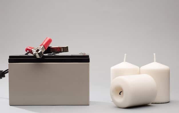 A close-up of a car battery being charged in a home garage.