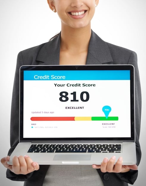 A person using a laptop to check their credit score online. The screen shows a detailed credit report with graphs and charts indicating credit history and score.