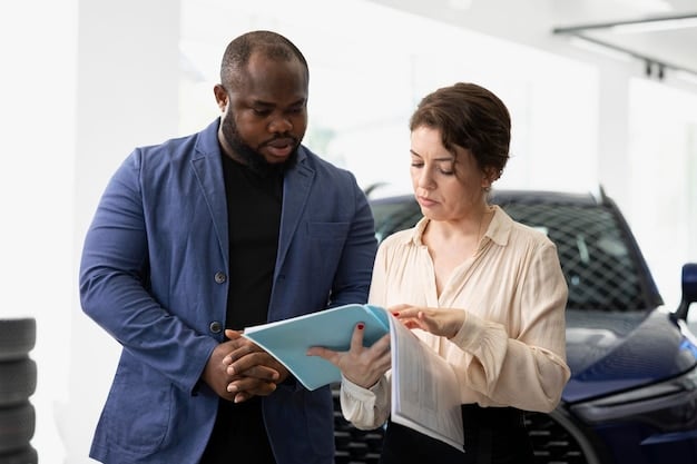 A person signing a car loan agreement at a dealership, with the salesperson assisting in the process. The atmosphere is professional and focused on the paperwork.