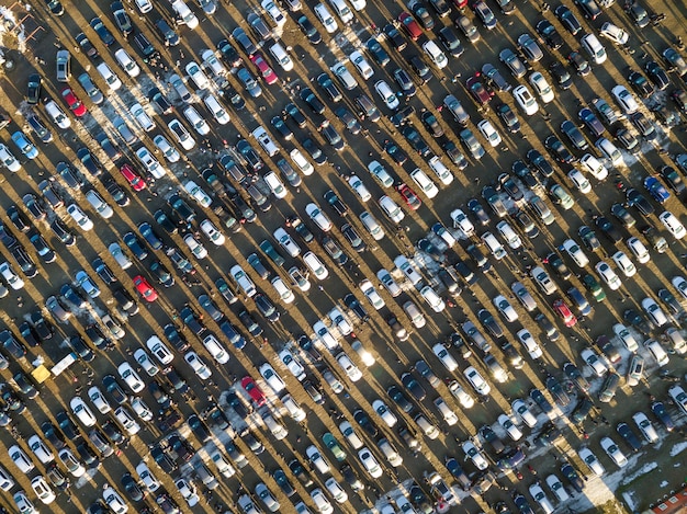 Image featuring a car dealership lot with various new and used cars, highlighting the inventory shortage and its effects on consumer choice and pricing.