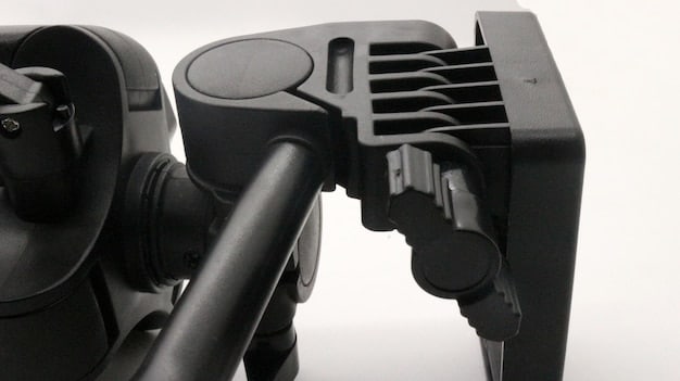A close-up shot of a robotic arm assembling an electric vehicle battery pack in a modern, automated factory setting. The lighting should be bright and highlight the precision and efficiency of the manufacturing process.