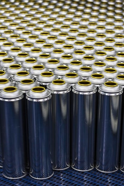 A detailed close-up of raw materials being loaded into a battery production machine, including lithium, nickel, and cobalt. The image highlights the precision and cleanliness of the operation, with workers in protective gear overseeing the process.