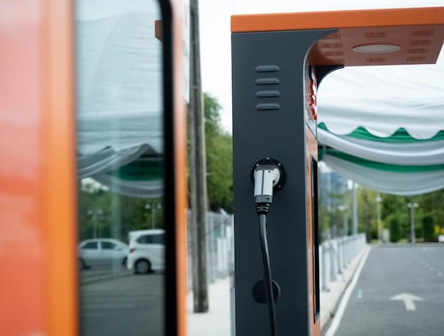 A public electric vehicle charging station with several cars plugged in and charging. The charging station is located in a well-lit area, possibly a parking lot or rest stop, and features visible signage and branding.