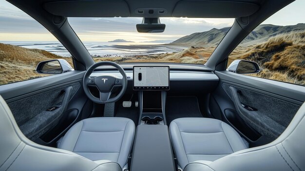 Interior shot of the 2025 Tesla Model 3, highlighting the minimalist dashboard, the large central touchscreen display, and the premium materials used, emphasizing the modern and technology-driven design.