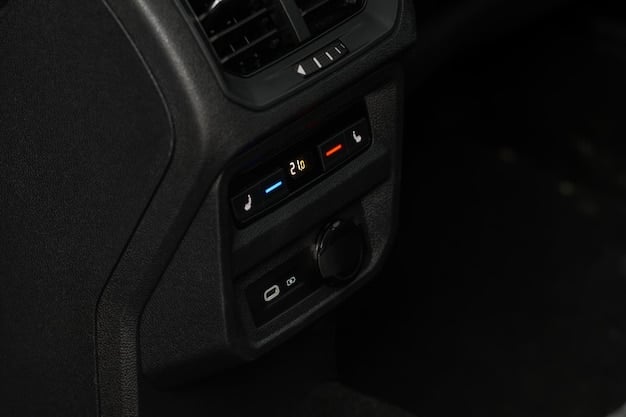 Close-up shot of the 2025 Hyundai Kona Electric's dashboard, highlighting the dual 12.3-inch screens, minimalist design, and ambient lighting.