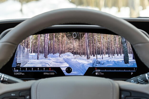 Close up of the Subaru EyeSight system's dual cameras mounted on the windshield inside a 2025 Subaru Outback.