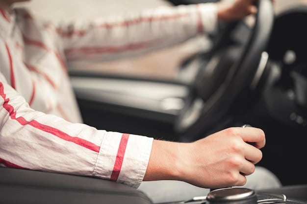 A driver's hands gripping the steering wheel of the 2025 Mercedes-Benz C-Class, focusing on the ergonomic design and the car's responsiveness on a curved road.