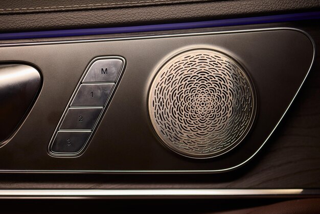 Close-up of the 2025 Cadillac Escalade's front grille, highlighting the Cadillac emblem and intricate detailing. The grille is chrome, and the background is slightly blurred to focus attention on the design elements.