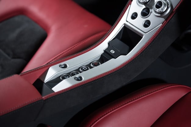 A detailed shot of the interior of the 2025 Volkswagen Golf GTI, focusing on the updated infotainment screen, sport seats with red accents, and the GTI-specific steering wheel.