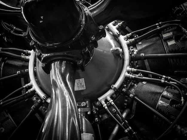 A detailed view of the engine bay of a 2025 Porsche 911, showcasing its meticulously engineered flat-six engine, with a focus on the turbochargers and performance components.