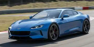 Futuristic 2025 sport coupe on a track, highlighting dynamic design