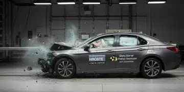 Frontal offset crash test of a 2026 family sedan, emphasizing advanced safety features.