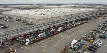 Modern U.S. automotive manufacturing plant with active assembly lines and logistics operations.