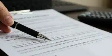 Car sales contract with pen, emphasizing financial details and dealer fees