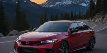 2026 Honda Civic Si in metallic red on a mountain road, showcasing its aggressive design and sporty appeal.